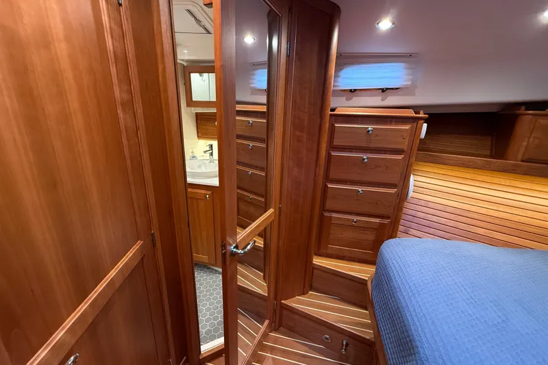 Slide: The Image of Luxurious 2023 Sabre 43 Salon Express interior with wooden cabinetry and cozy bedroom. - 76