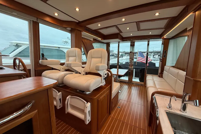 Slide: The Image of Luxurious interior of 2023 Sabre 43 Salon Express yacht with plush seating and elegant wood finishes. - 83