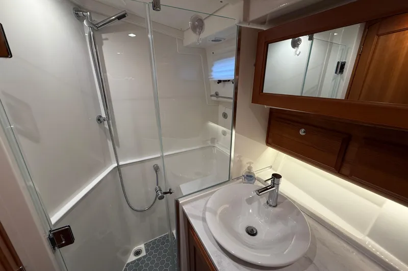 Slide: The Image of Modern bathroom in 2023 Sabre 43 Salon Express yacht with glass shower and sleek sink. - 84