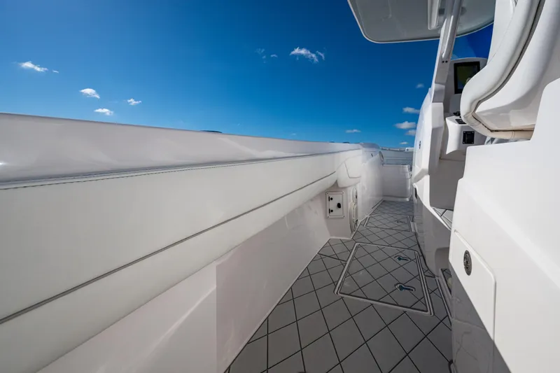 Slide: The Image of 2020 Intrepid 375 Nomad SE boat deck with clear blue sky. - 13