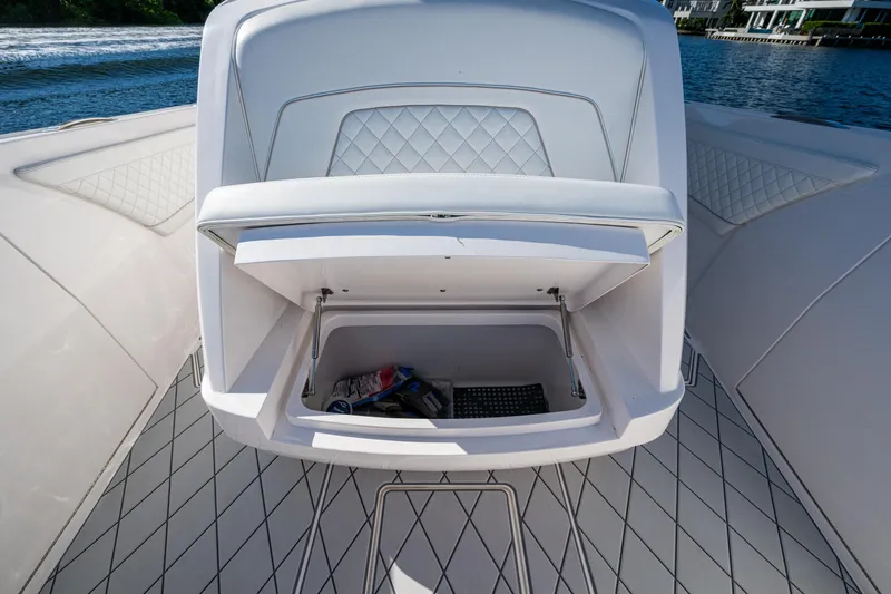 Slide: The Image of 2020 Intrepid 375 Nomad SE boat storage compartment open on deck. - 20