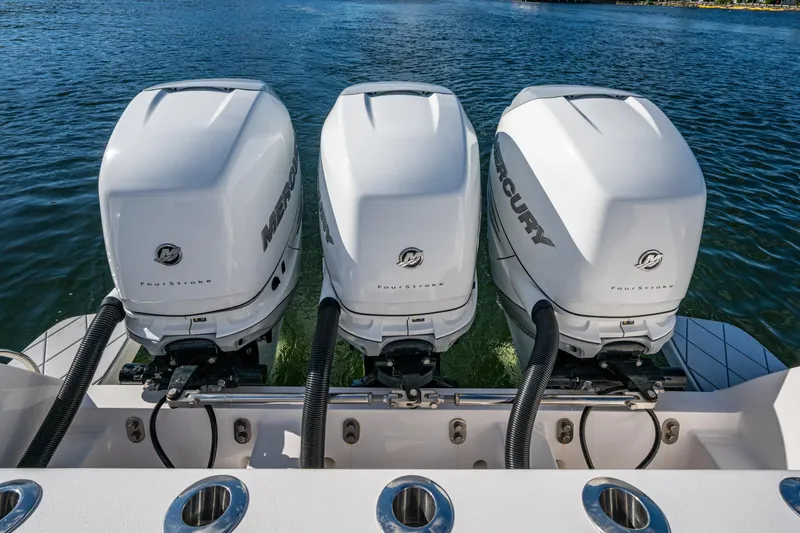 Slide: The Image of Triple Mercury outboard engines on a 2020 Intrepid 375 Nomad SE boat. - 32