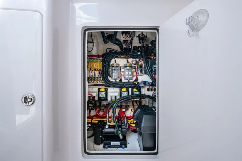 Slide: The Image of Electrical panel of 2020 Intrepid 375 Nomad SE boat, showcasing wiring and components. - 34