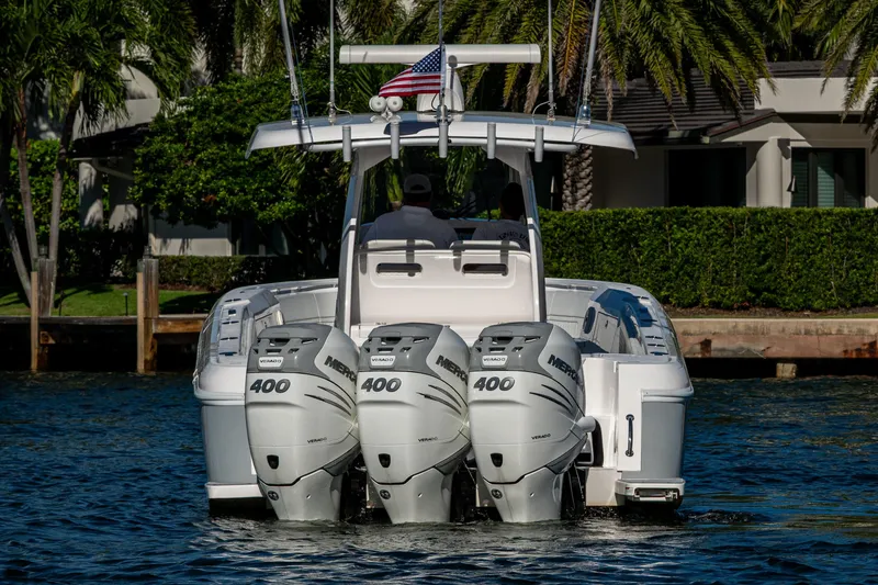 Slide: The Image of 2020 Intrepid 375 Nomad SE boat with triple Mercury 400 engines on water. - 6