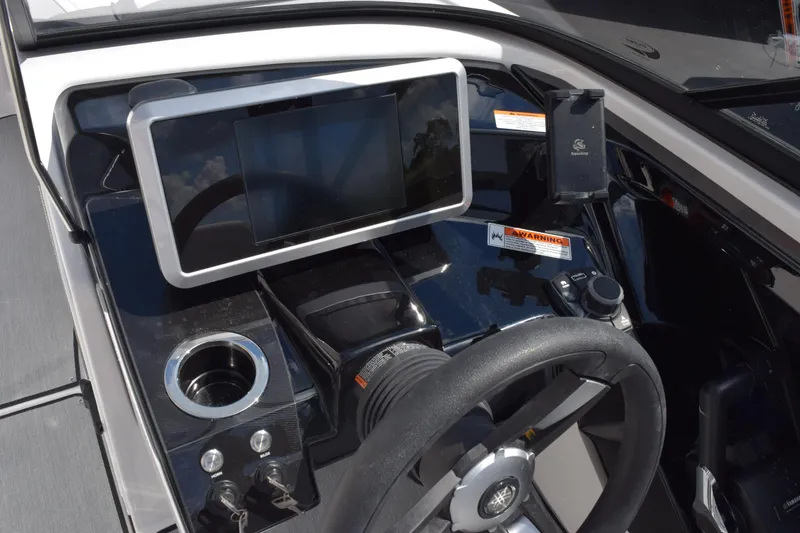 Slide: The Image of 2026 Yamaha AR250 boat dashboard with touchscreen display and steering wheel. - 11