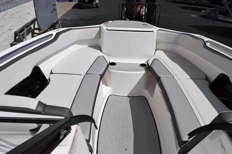 Slide: The Image of 2026 Yamaha Boats AR250 interior with spacious seating and modern design. - 12