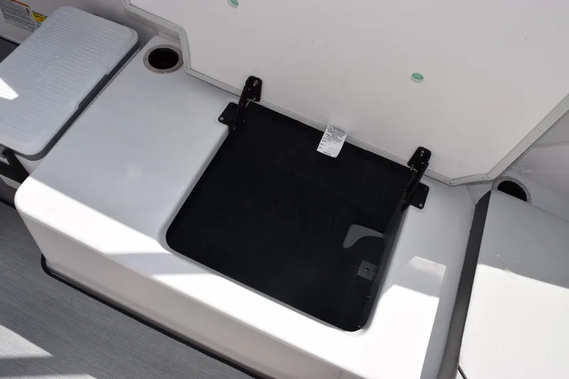 Slide: The Image of Open storage compartment on 2026 Yamaha Boats AR250, showcasing interior space. - 17
