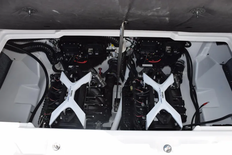 Slide: The Image of 2026 Yamaha Boats AR250 engine compartment with twin engines and wiring. - 19