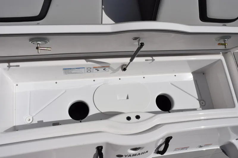 Slide: The Image of Open storage compartment of 2026 Yamaha Boats AR250, showcasing interior design and features. - 20