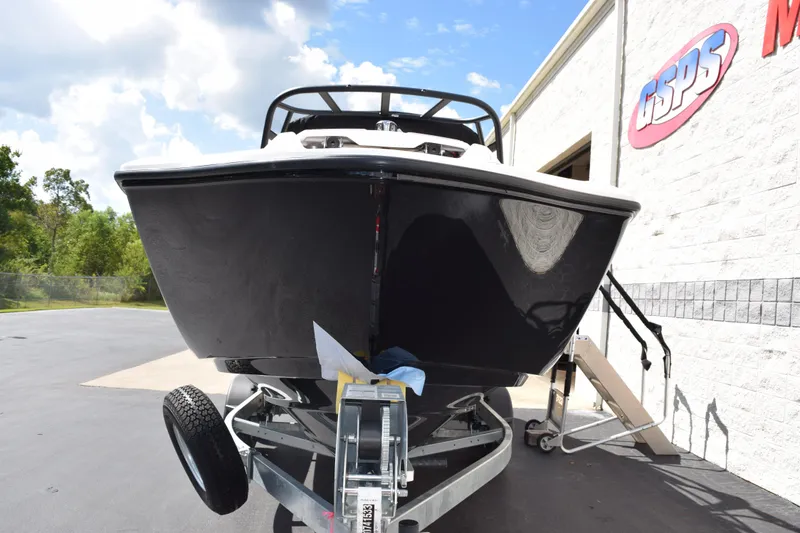 Slide: The Image of 2026 Yamaha Boats AR250 on trailer outside dealership, sunny day. - 3