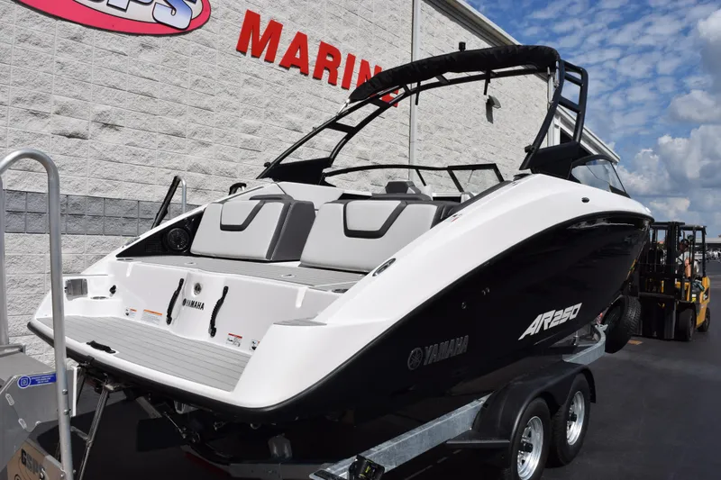 Slide: The Image of 2026 Yamaha AR250 boat on trailer, sleek design, displayed outdoors. - 4