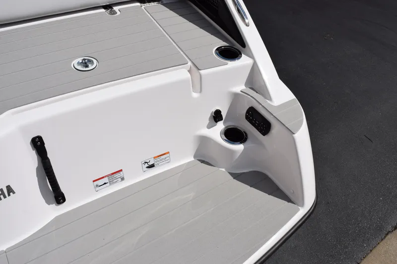 Slide: The Image of 2026 Yamaha AR250 boat deck with cup holders and control panel. - 6