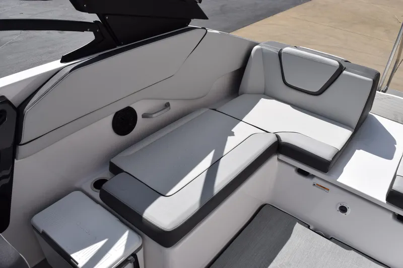 Slide: The Image of 2026 Yamaha Boats AR250 interior seating with sleek gray upholstery and modern design. - 7
