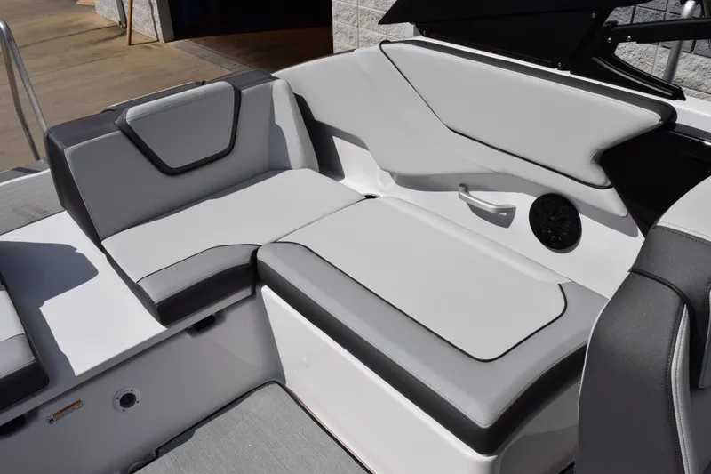 Slide: The Image of 2026 Yamaha Boats AR250 interior seating with sleek gray upholstery and modern design. - 8