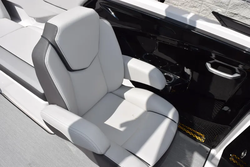 Slide: The Image of 2026 Yamaha Boats AR250 interior with sleek, modern seating and cup holders. - 9