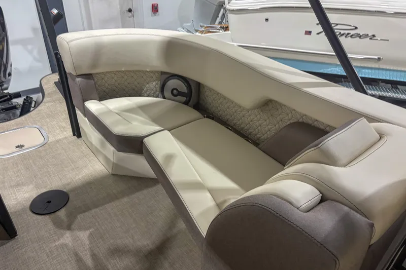 Slide: The Image of Luxurious seating in 2026 Alera M23Q boat, featuring beige and brown upholstery. - 13