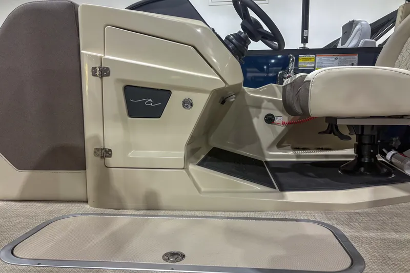 Slide: The Image of Interior of 2026 Alera M23Q boat, featuring steering wheel and seating area. - 4