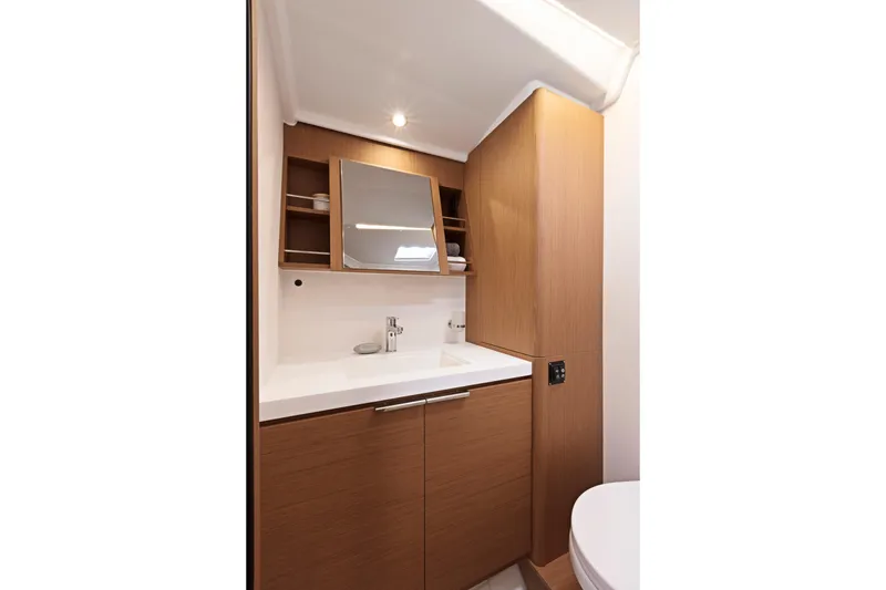 Slide: The Image of Luxurious bathroom interior of 2026 Beneteau First 53 yacht with modern wood cabinetry. - 14