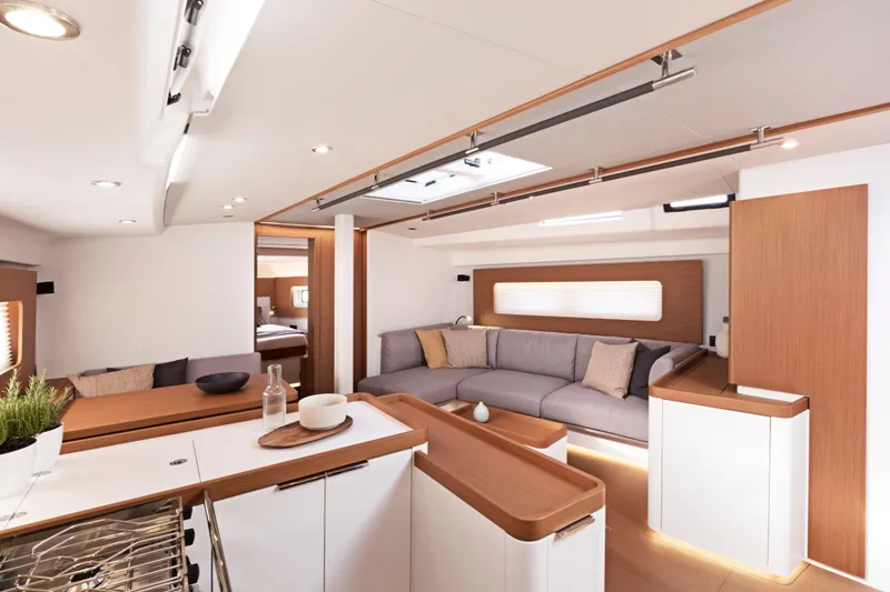 Slide: The Image of Luxurious interior of 2026 Beneteau First 53 yacht with modern design and cozy seating area. - 16