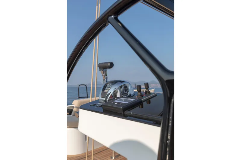 Slide: The Image of 2026 Beneteau First 53 yacht helm with modern controls and ocean view. - 27