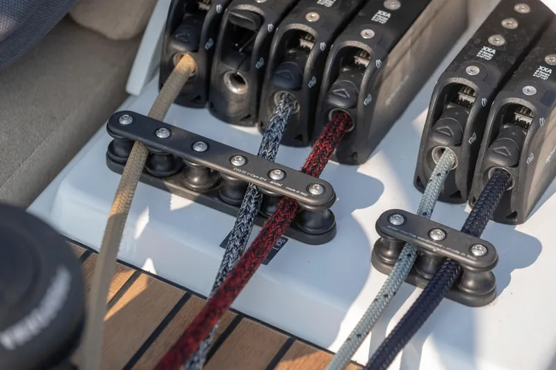 Slide: The Image of Close-up of sailing ropes and clutches on a 2026 Beneteau First 53 yacht. - 29
