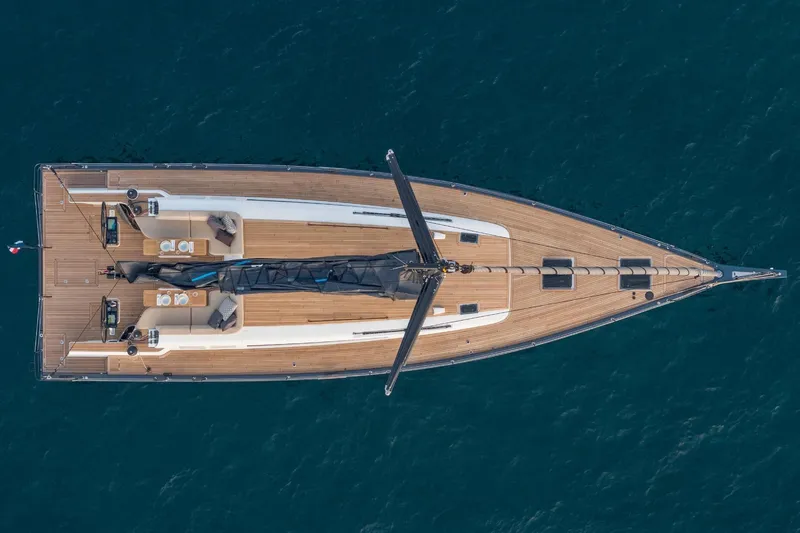 Slide: The Image of Aerial view of 2026 Beneteau First 53 yacht on blue ocean water. - 3