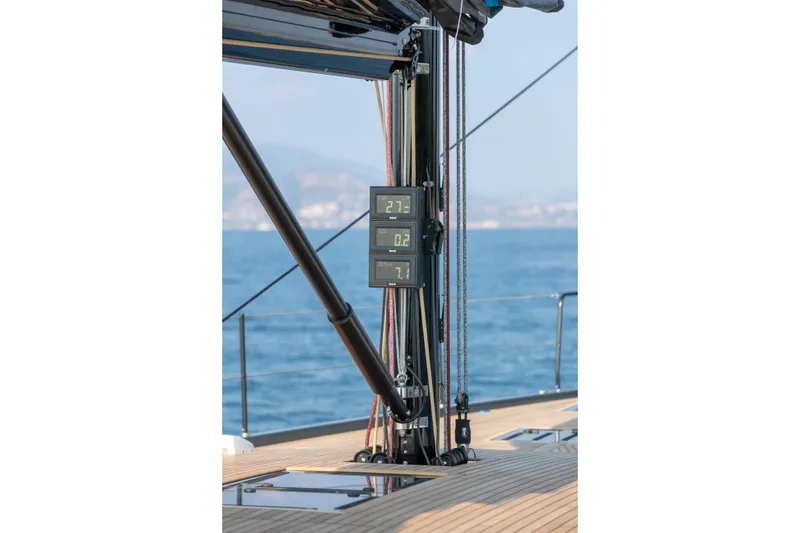 Slide: The Image of Beneteau First 53 yacht mast with digital displays, sailing on open sea, 2026 model. - 30