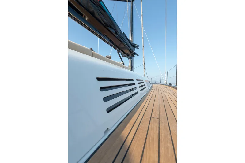 Slide: The Image of 2026 Beneteau First 53 yacht deck with sleek design and wooden finish. - 34