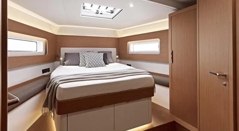 Slide: The Image of Luxurious bedroom interior of 2025 Beneteau First 53 yacht with modern design. - 4