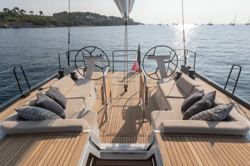 Slide: The Image of Luxurious deck of 2026 Beneteau First 53 yacht with elegant seating and dual steering wheels. - 40