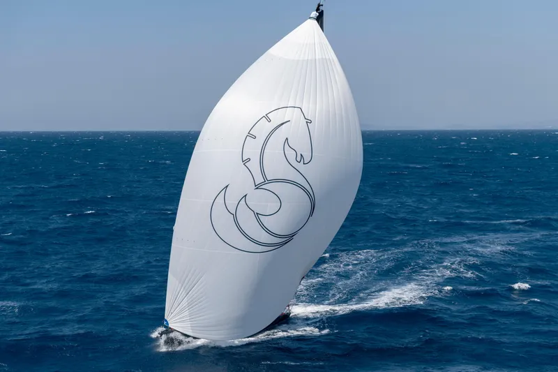 Slide: The Image of Sailing yacht Beneteau First 53, 2026 model, with large spinnaker on open sea. - 43
