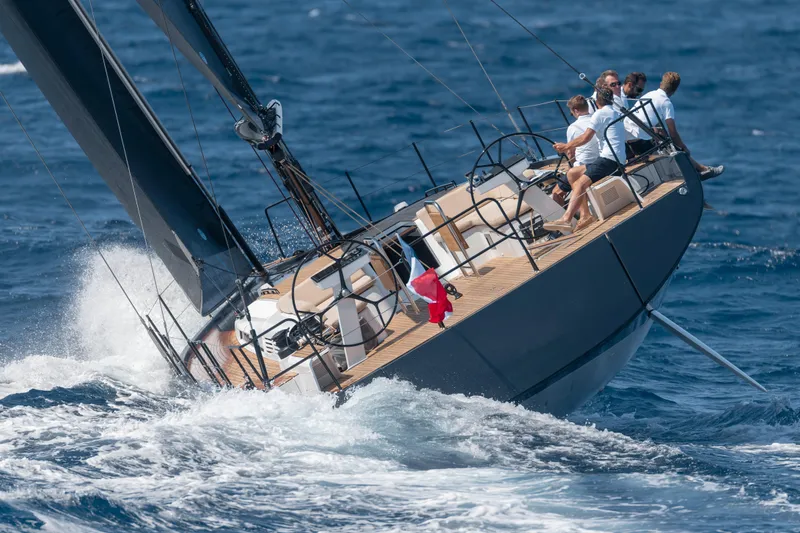 Slide: The Image of 2026 Beneteau First 53 sailing on open sea with crew onboard. - 45