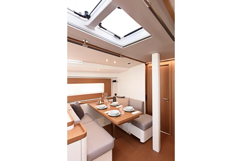 Slide: The Image of Luxurious interior of 2026 Beneteau First 53 yacht, featuring elegant dining area and modern design. - 7