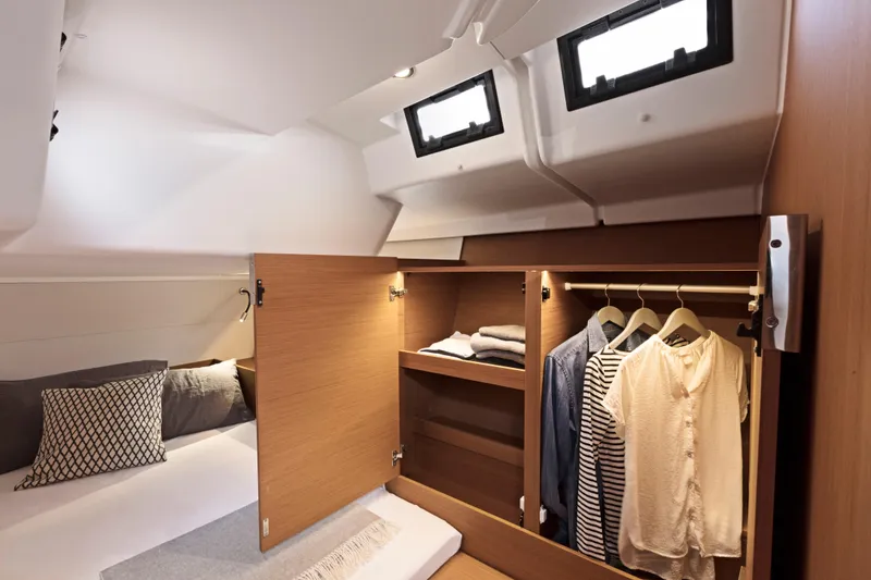 Slide: The Image of Luxurious cabin interior of 2026 Beneteau First 53 yacht with wardrobe and bedding. - 9