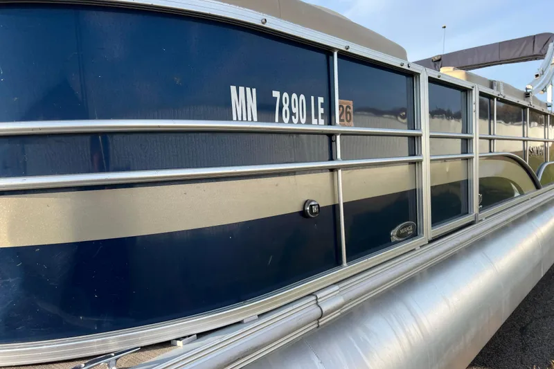 Slide: The Image of 2015 Sylvan Mirage Fish 8522 Party Fish LE pontoon boat, blue exterior, docked. - 14