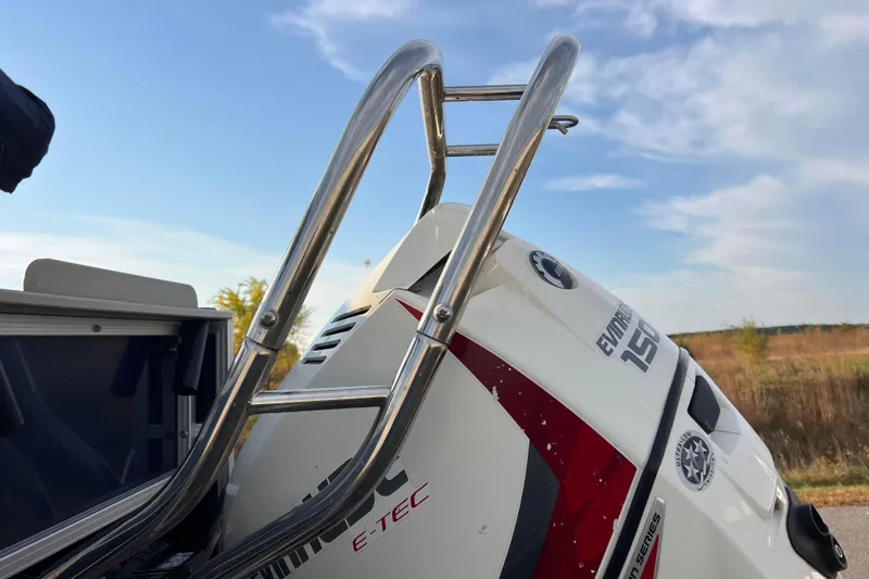 Slide: The Image of 2015 Sylvan Mirage Fish 8522 boat with Evinrude E-TEC engine and ladder, outdoors. - 18