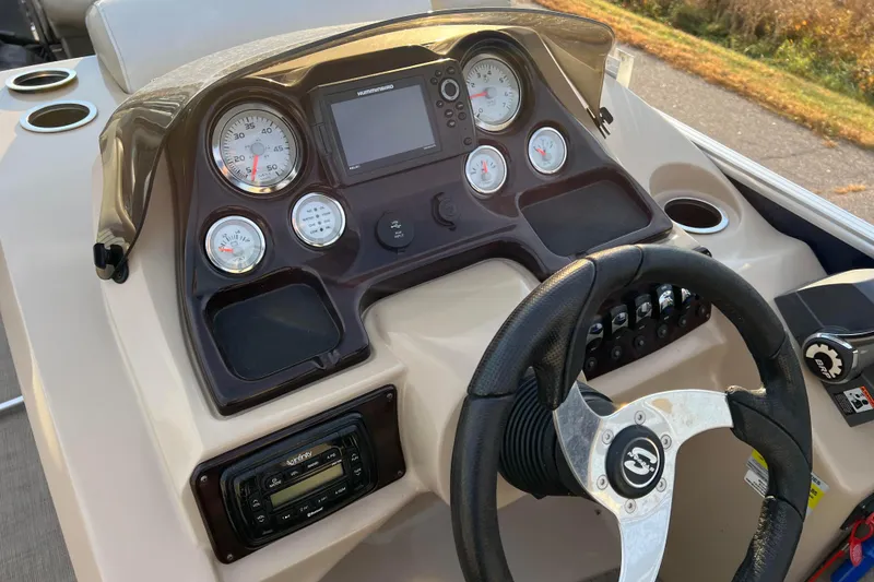 Slide: The Image of Control panel of 2015 Sylvan Mirage Fish 8522 Party Fish LE boat with steering wheel and gauges. - 25