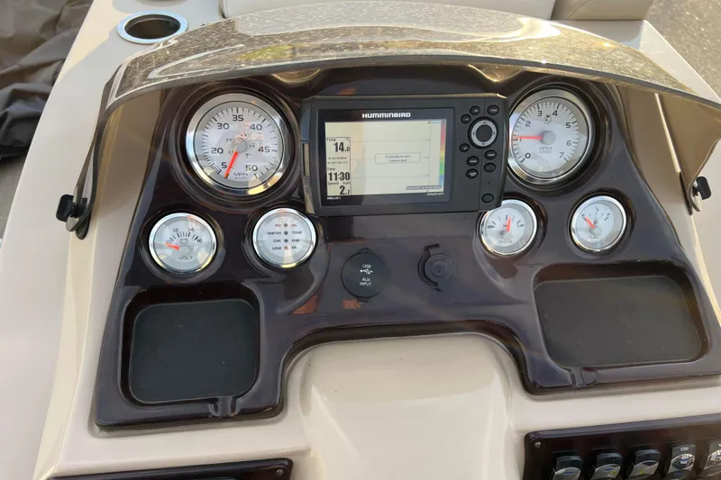 Slide: The Image of Dashboard of 2015 Sylvan Mirage Fish 8522 Party Fish LE with gauges and Humminbird display. - 28