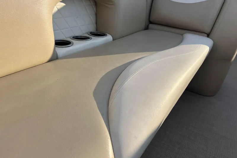 Slide: The Image of Beige seating with cup holders on a 2015 Sylvan Mirage Fish 8522 Party Fish LE boat. - 42