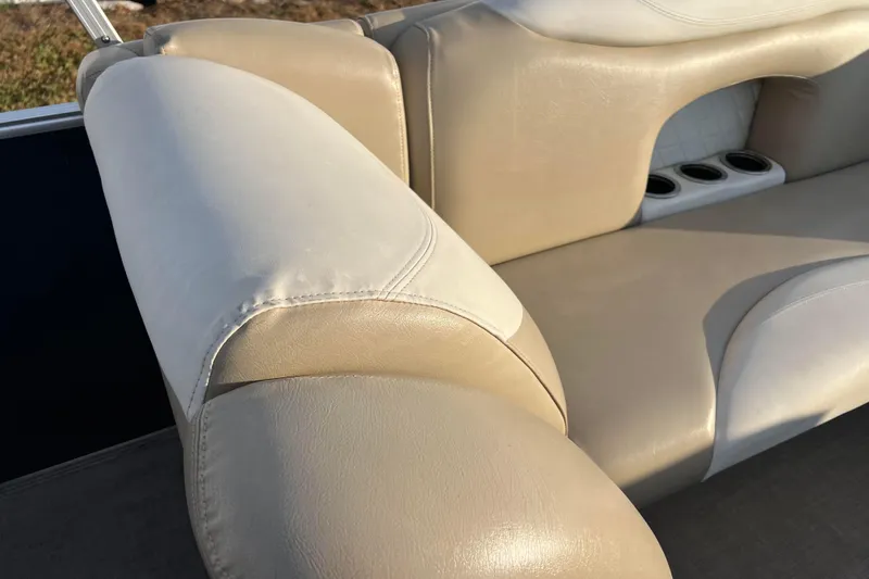 Slide: The Image of 2015 Sylvan Mirage Fish 8522 Party Fish LE boat seating with cup holders, beige upholstery. - 43