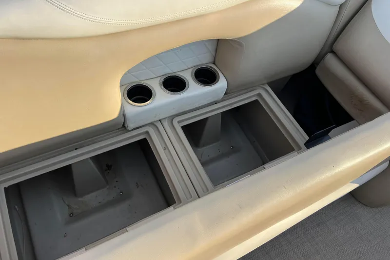 Slide: The Image of 2015 Sylvan Mirage Fish 8522 Party Fish LE boat storage compartments and cup holders. - 44