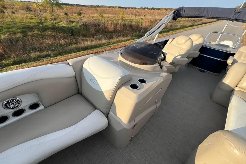 Slide: The Image of 2015 Sylvan Mirage Fish 8522 Party Fish LE interior with beige seating and console. - 46