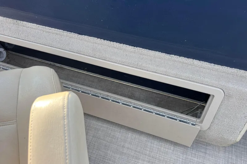 Slide: The Image of Interior of 2015 Sylvan Mirage Fish 8522 Party Fish LE boat, featuring seating and storage. - 51