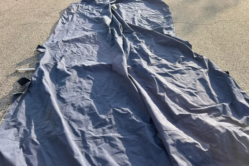 Slide: The Image of Blue boat cover for 2015 Sylvan Mirage Fish 8522 Party Fish LE on pavement. - 55