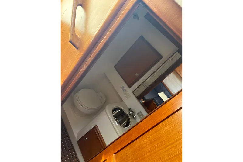 Slide: The Image of Interior of 2006 Topaz Express Cruiser bathroom with sink and toilet. - 10