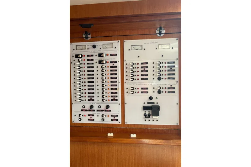 Slide: The Image of Electrical control panel on a 2006 Topaz Express Cruiser boat interior. - 16