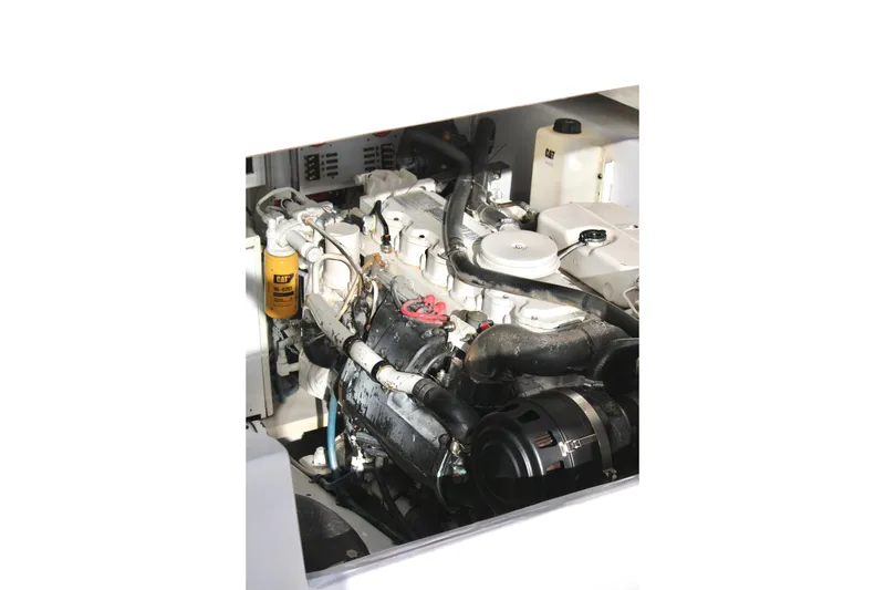 Slide: The Image of Engine compartment of a 2006 Topaz Express Cruiser, featuring detailed mechanical components. - 18