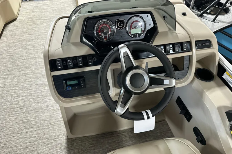Slide: The Image of Steering console of 2026 Godfrey SWEETWATER 2286 SB boat with modern controls and gauges. - 12