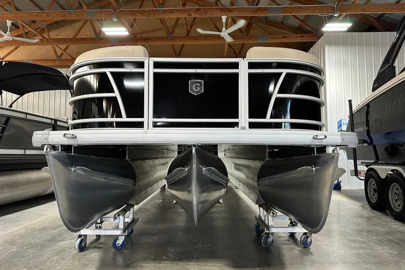 Slide: The Image of 2026 Godfrey SWEETWATER 2286 SB pontoon boat in a storage facility. - 2