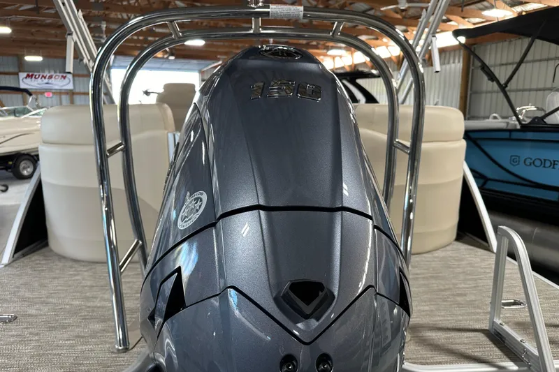 Slide: The Image of 2026 Godfrey SWEETWATER 2286 SB boat engine in showroom, showcasing sleek design. - 7